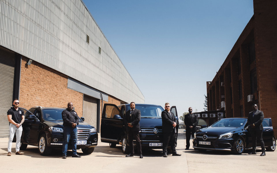 agents guarding car during hostile environment security operation